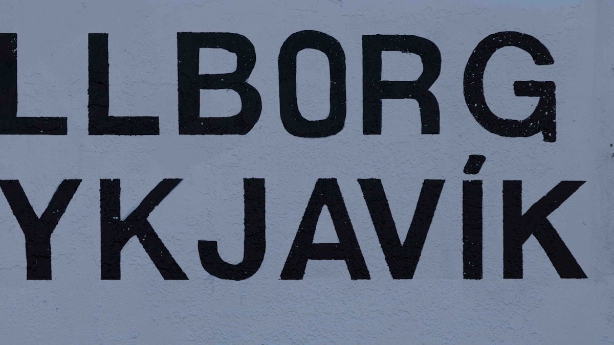 The stark, bold lettering of "GULLBORG REYKJAVIK" on a simple wall offers a clear and direct representation of Reykjavik's urban identity. This typographic treatment reflects the city's modern and straightforward aesthetic, commonly seen in its cultural branding.